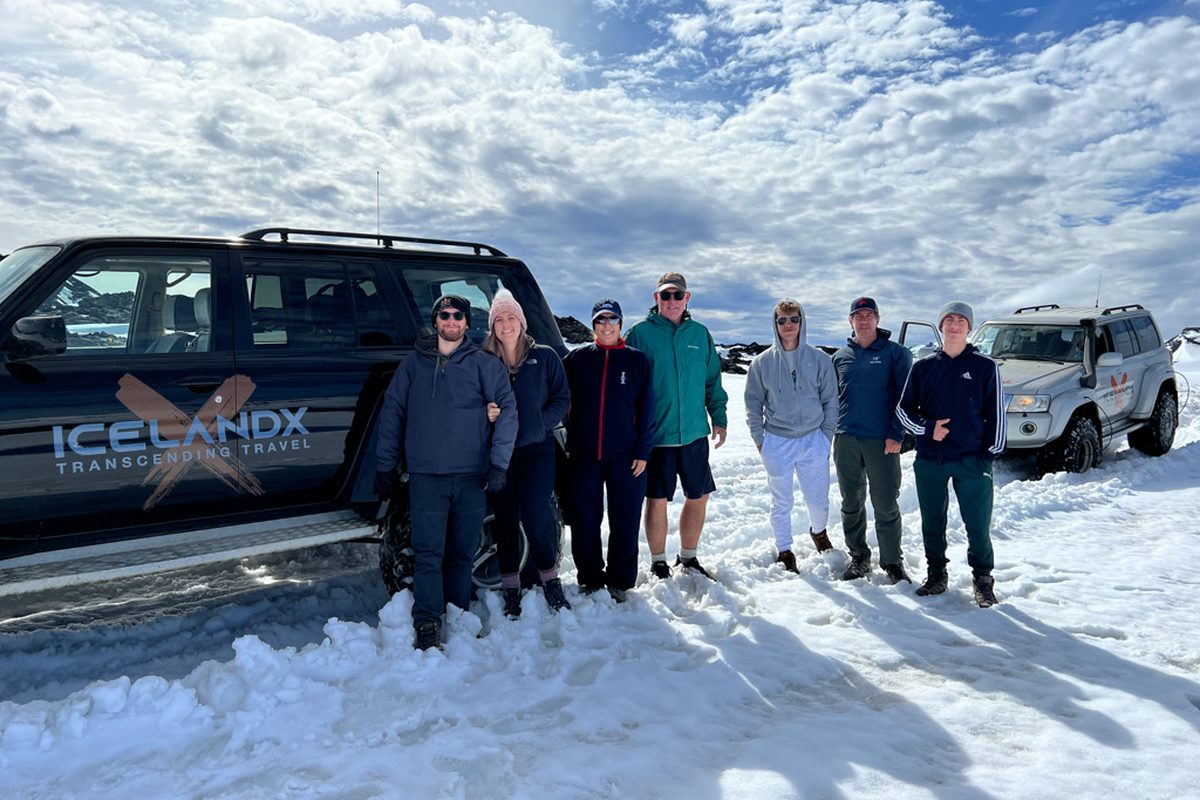 A family with the IcelandX jeeps on the glacier